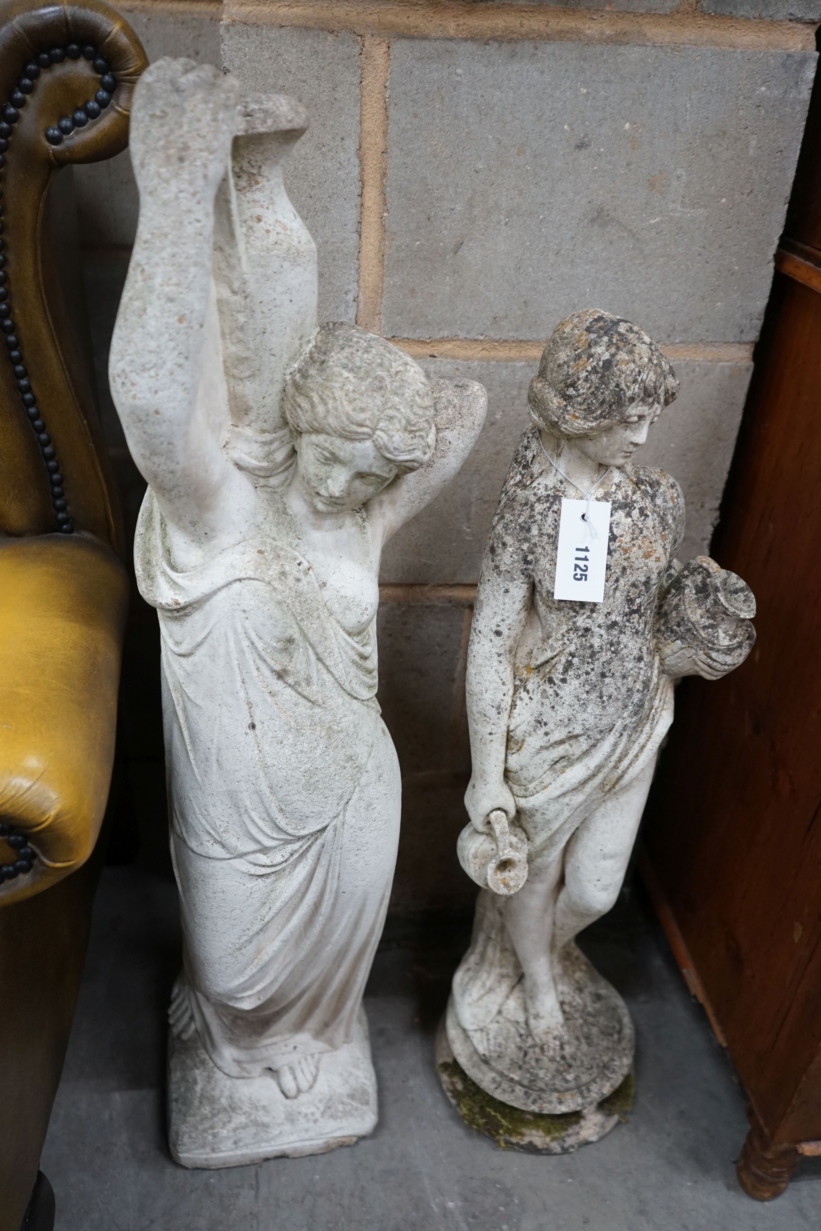 Two reconstituted stone figural garden ornaments, larger height 88cm